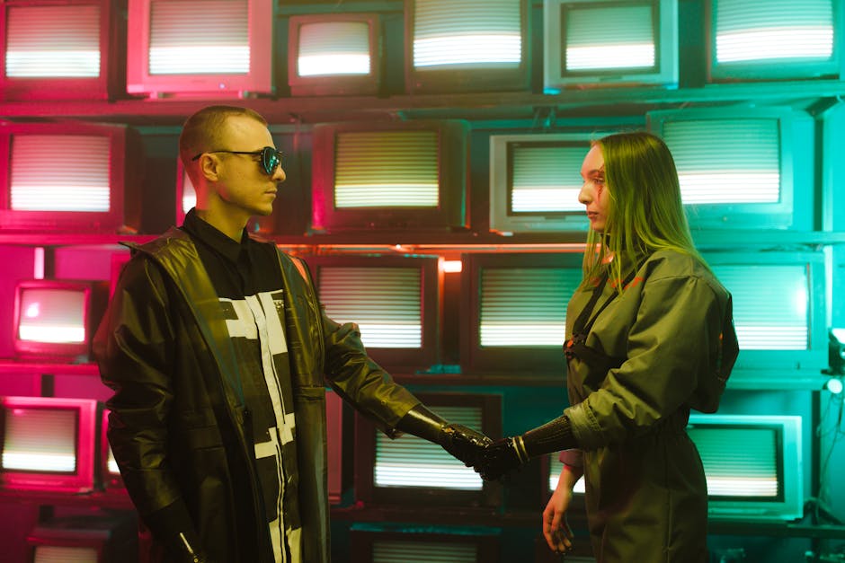 Two individuals with prosthetic arms engage in a handshake amidst a vibrant, retro television backdrop.