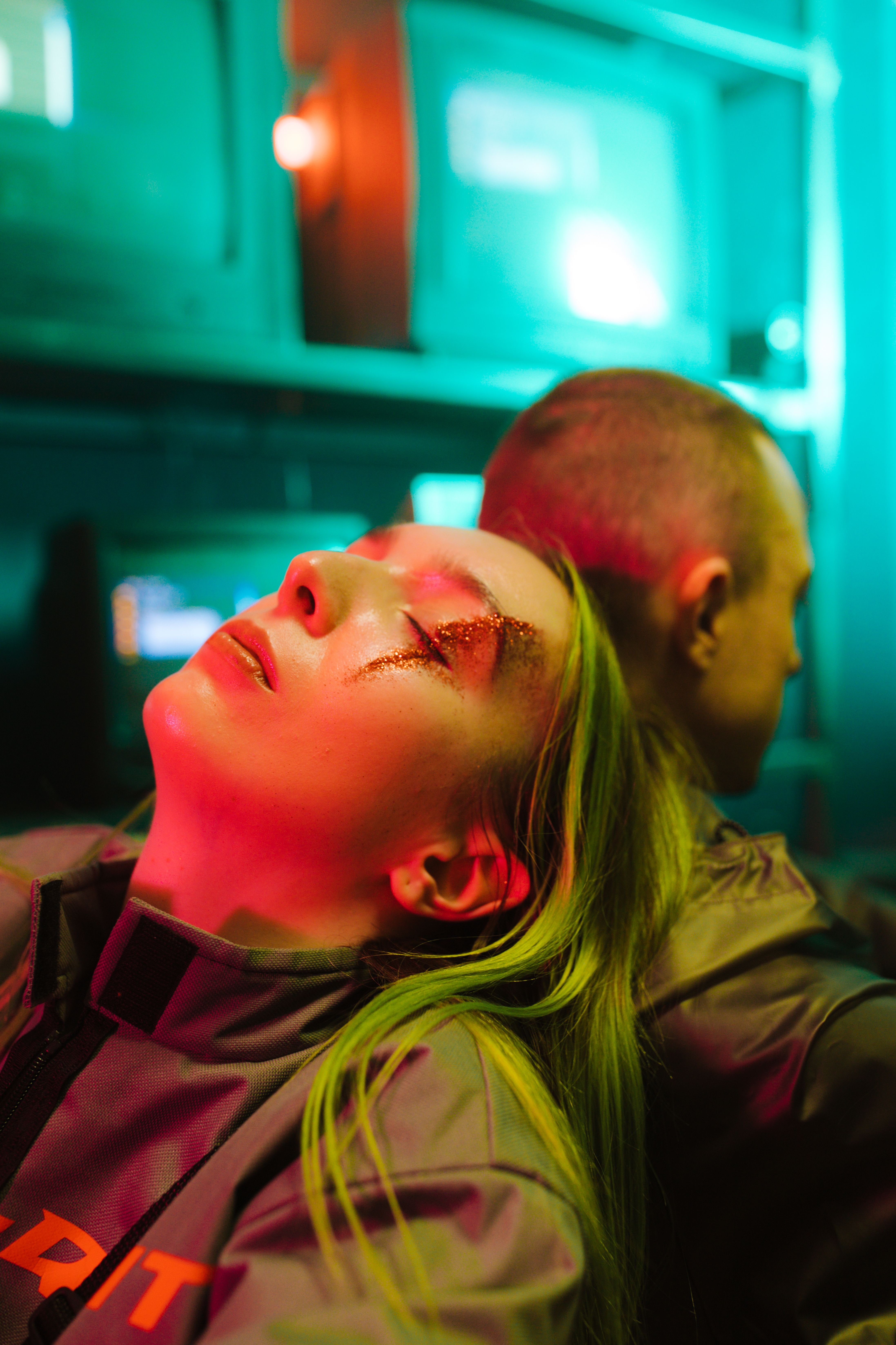 A vibrant cyberpunk portrait featuring a man and woman in neon ambiance. - Fotografer Sidoarjo