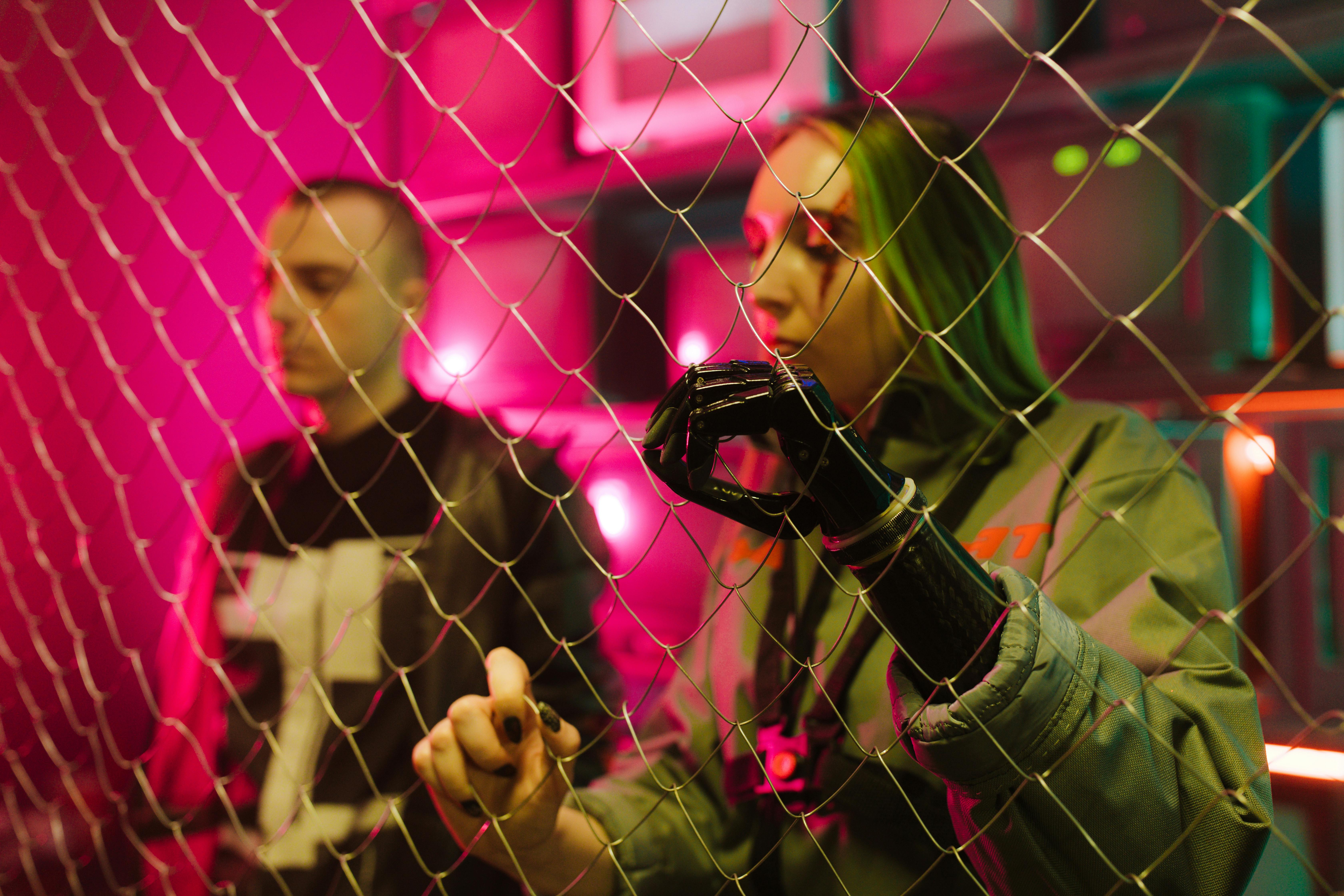 man and woman with prosthesis in futuristic surroundings