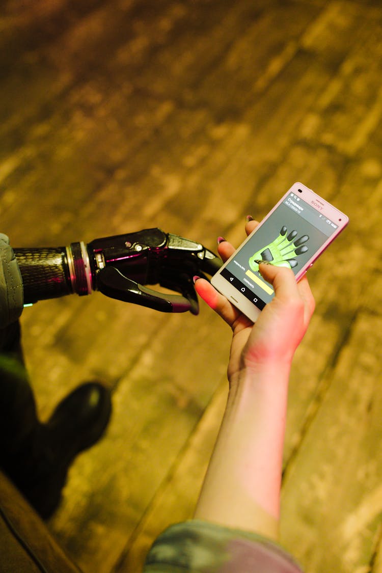 A Person Controlling Prosthetic Hand Using A Smartphone