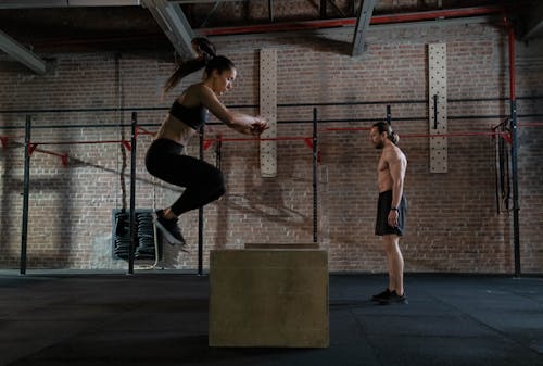 Man and Woman Practicing Plyometrics