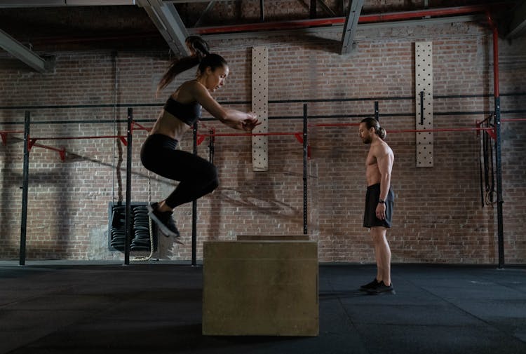 Man And Woman Practicing Plyometrics