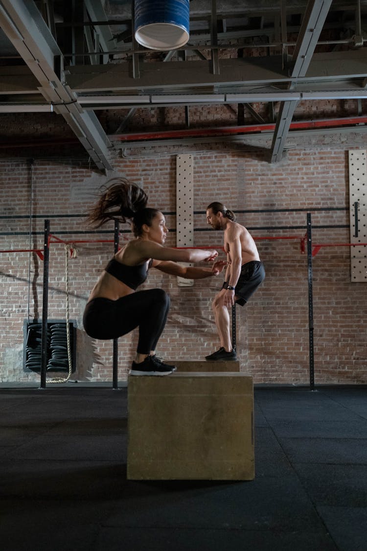 Man And Woman Practicing Plyometrics