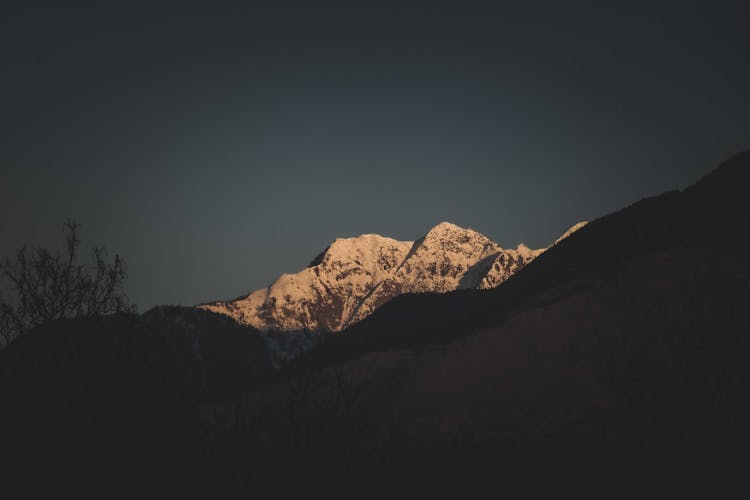 Top Of Mountain With Snow In Twilight