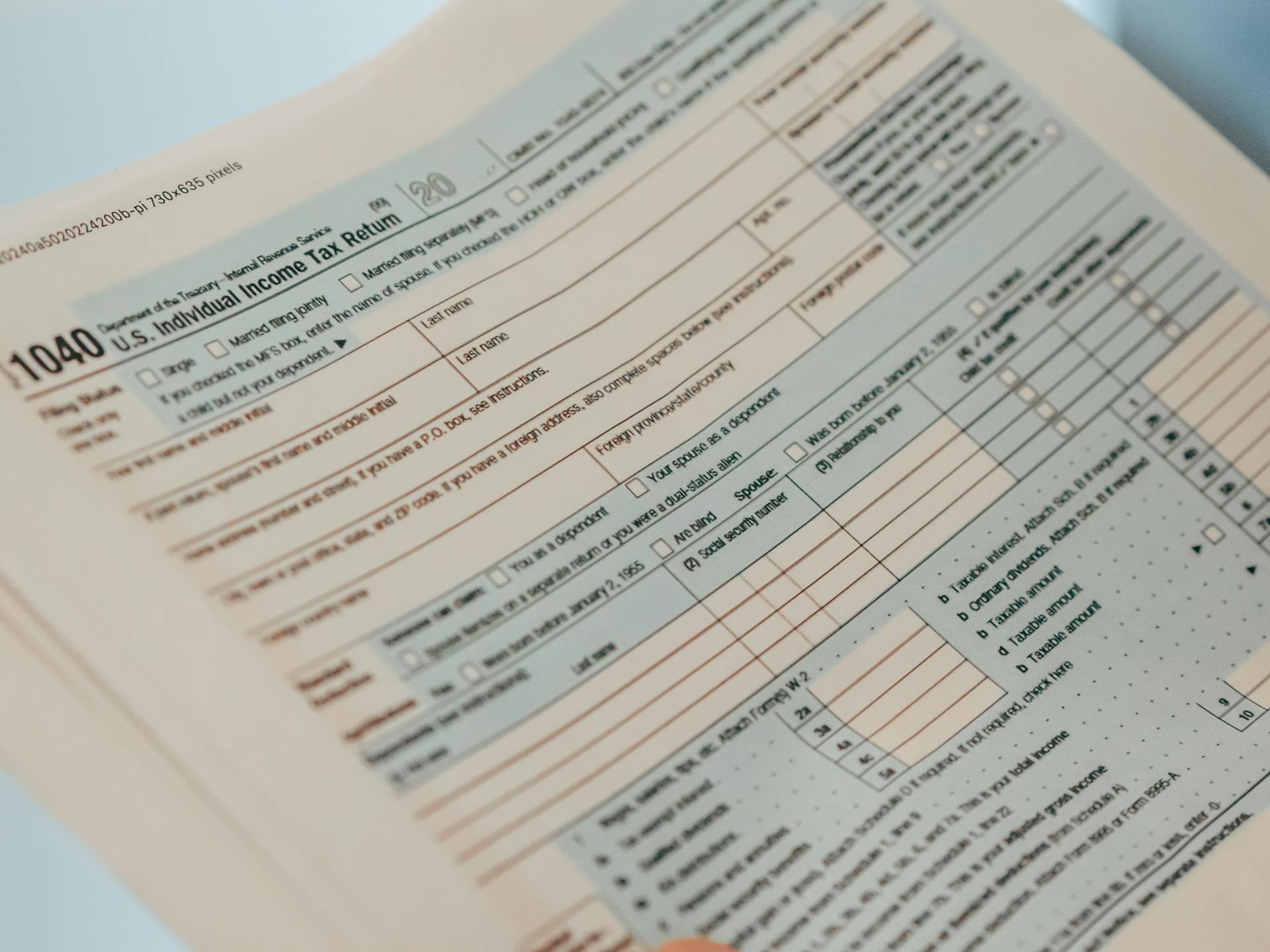 Detailed close-up image of a U.S. 1040 Individual Income Tax Return form, ideal for finance-related content.