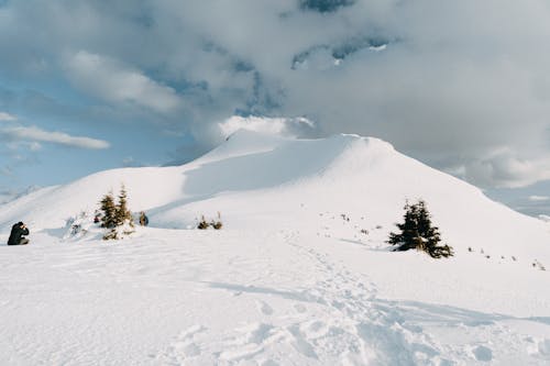 Footsteps on the Snowy Mountain Hill