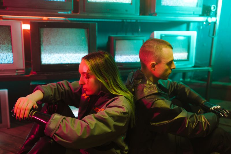 A futuristic scene capturing two individuals in a cyberpunk setting surrounded by televisions.