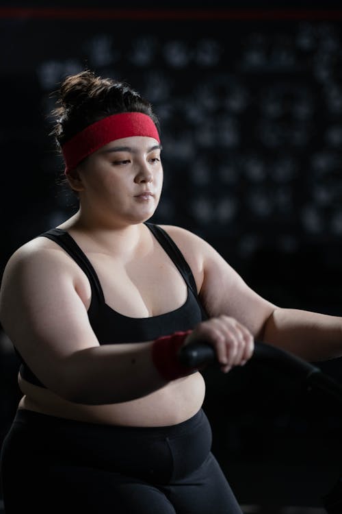 Woman in Black Activewear Exercising