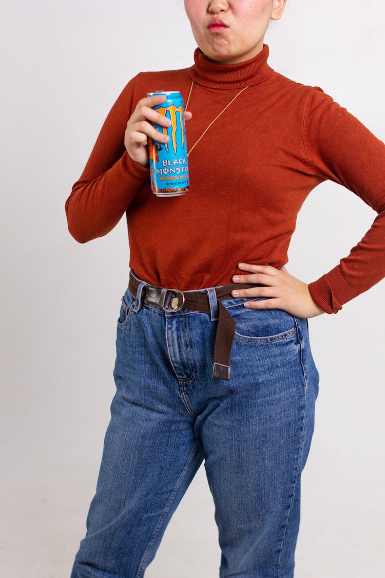 A Person Holding Monster Energy Drink