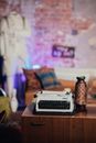 Black and White Typewriter on Brown Wooden Table