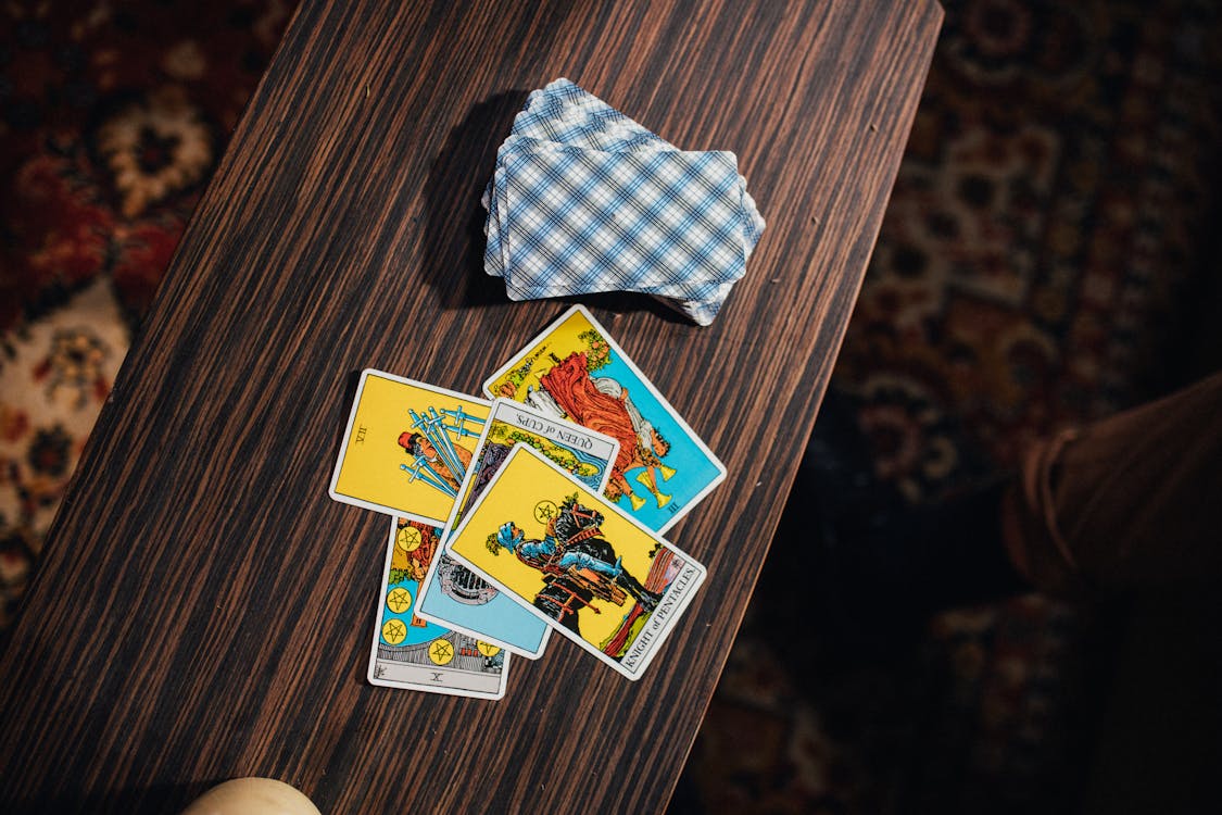 Free Tarot Cards on Wooden Table Stock Photo