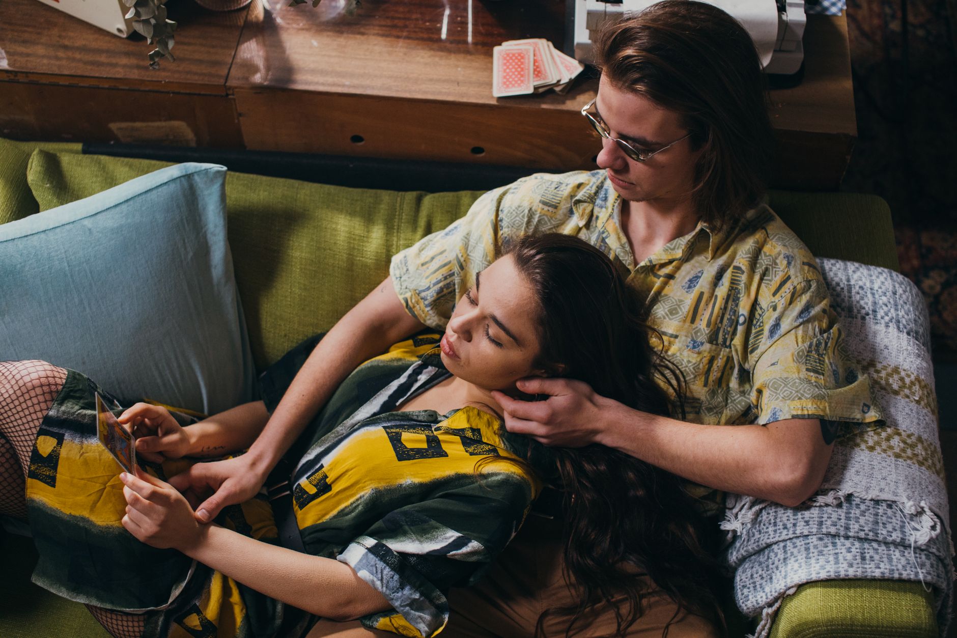 A couple enjoying a peaceful moment together on a sofa, sharing quality time and memories.