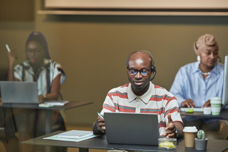 People Working With Headsets