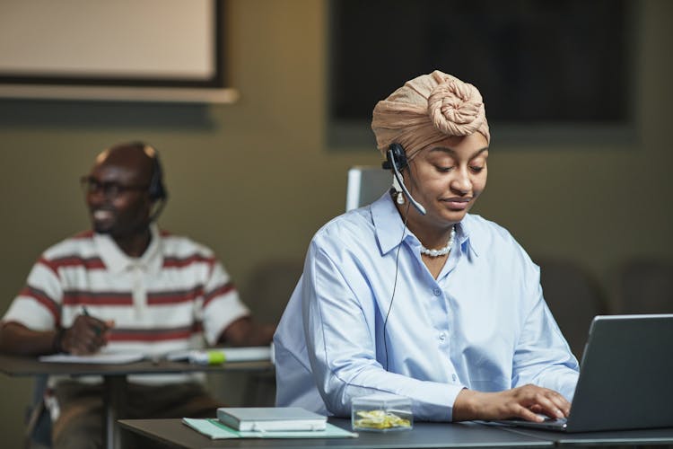 Woman Typing On A Laptop