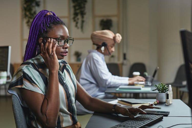 Woman Wearing Eyeglasses While Working In The Office