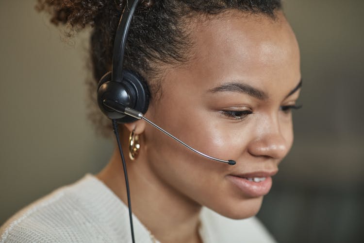 Close-Up Shot Of A Woman Wearing Headphones