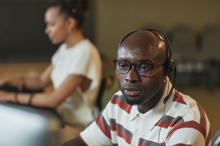 A Man Using Headphone With Mic