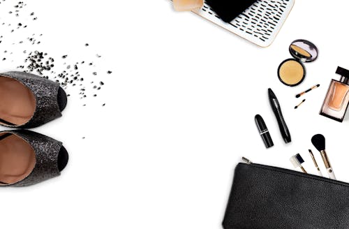 Free Women's Assorted Makeups and Black Glittered Pumps Stock Photo