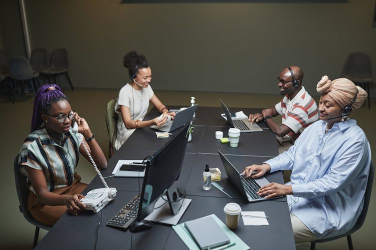 People Working In Call Center Office