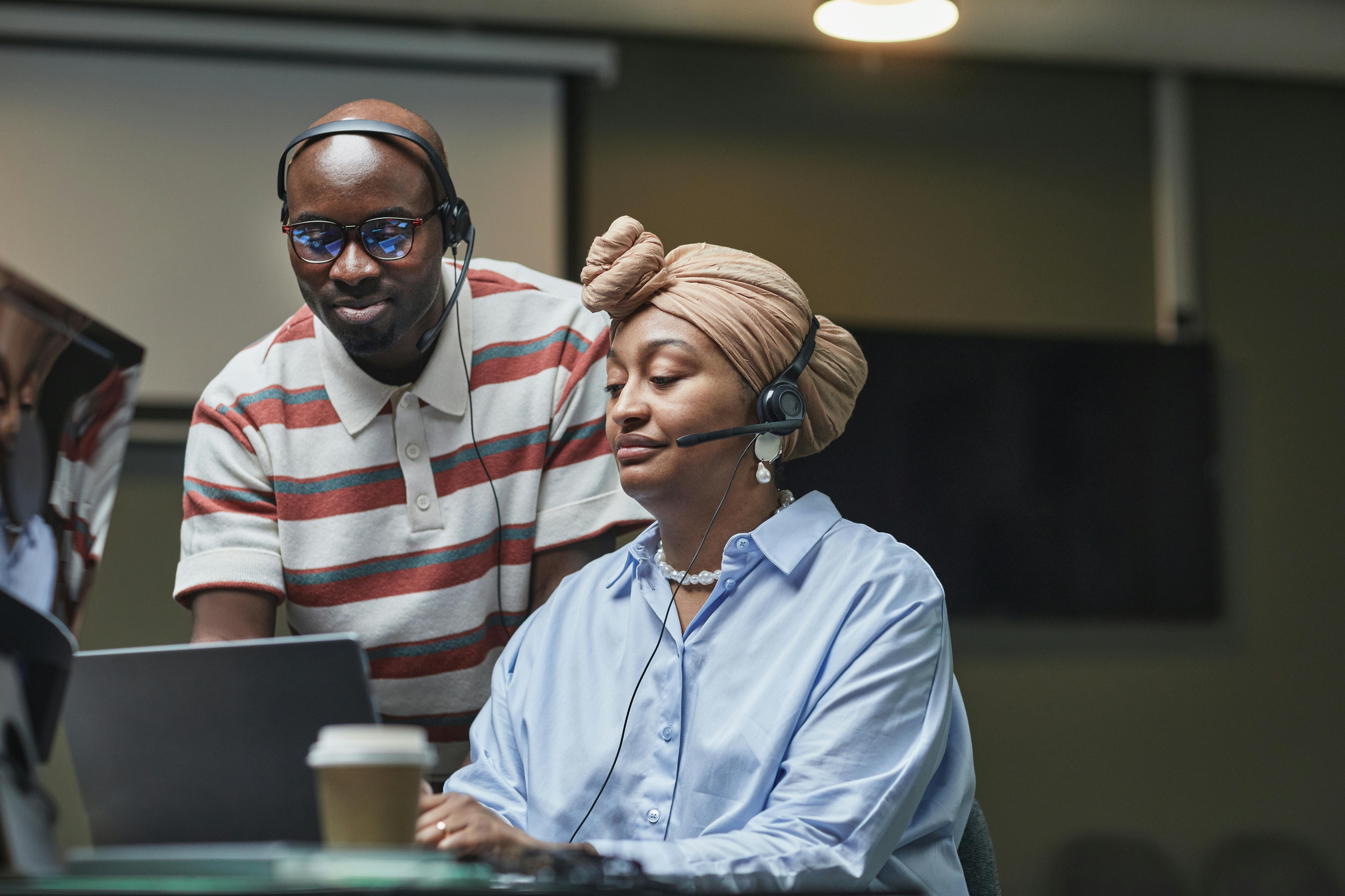 Multiethnic team working together in an office, showcasing diversity and collaboration.