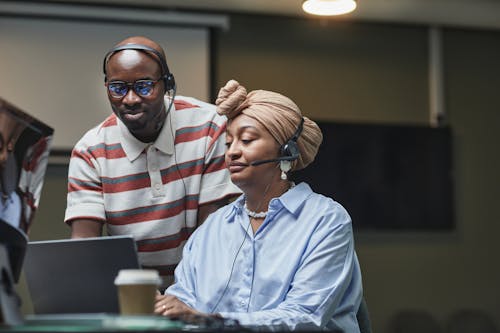 Free Man and Woman Doing Work Together Stock Photo