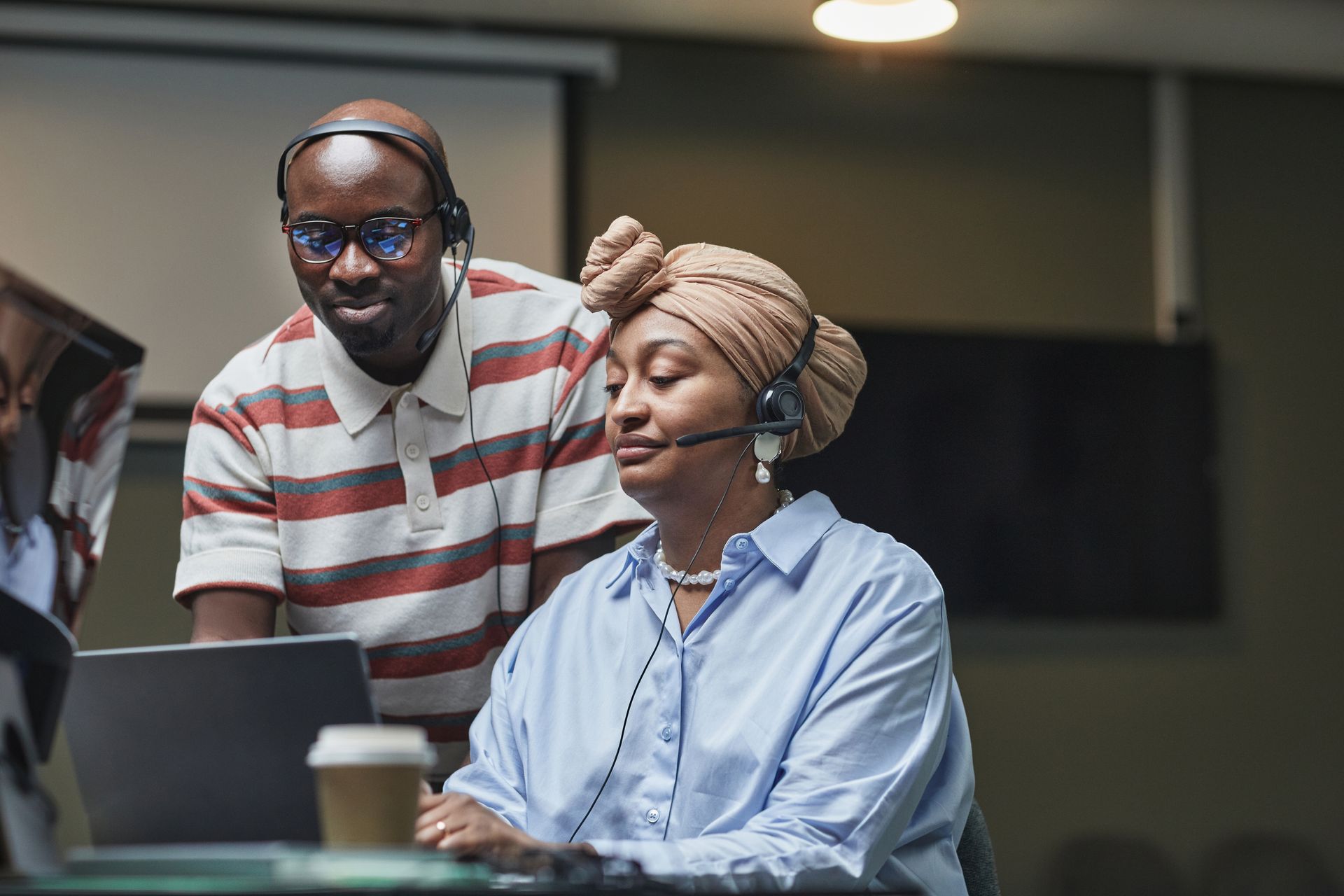 Multiethnic team working together in an office, showcasing diversity and collaboration.