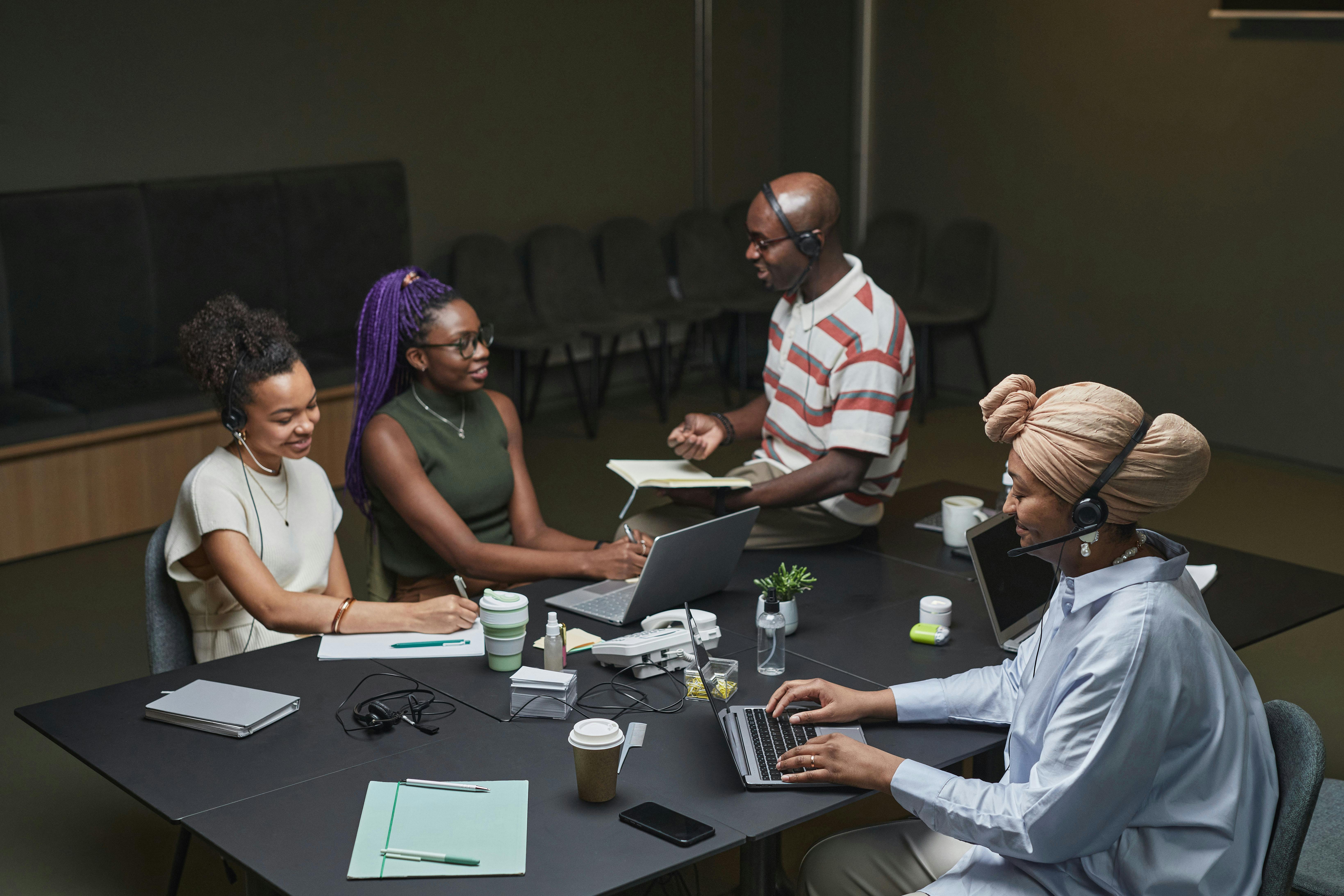 people sitting at the table having a meeting