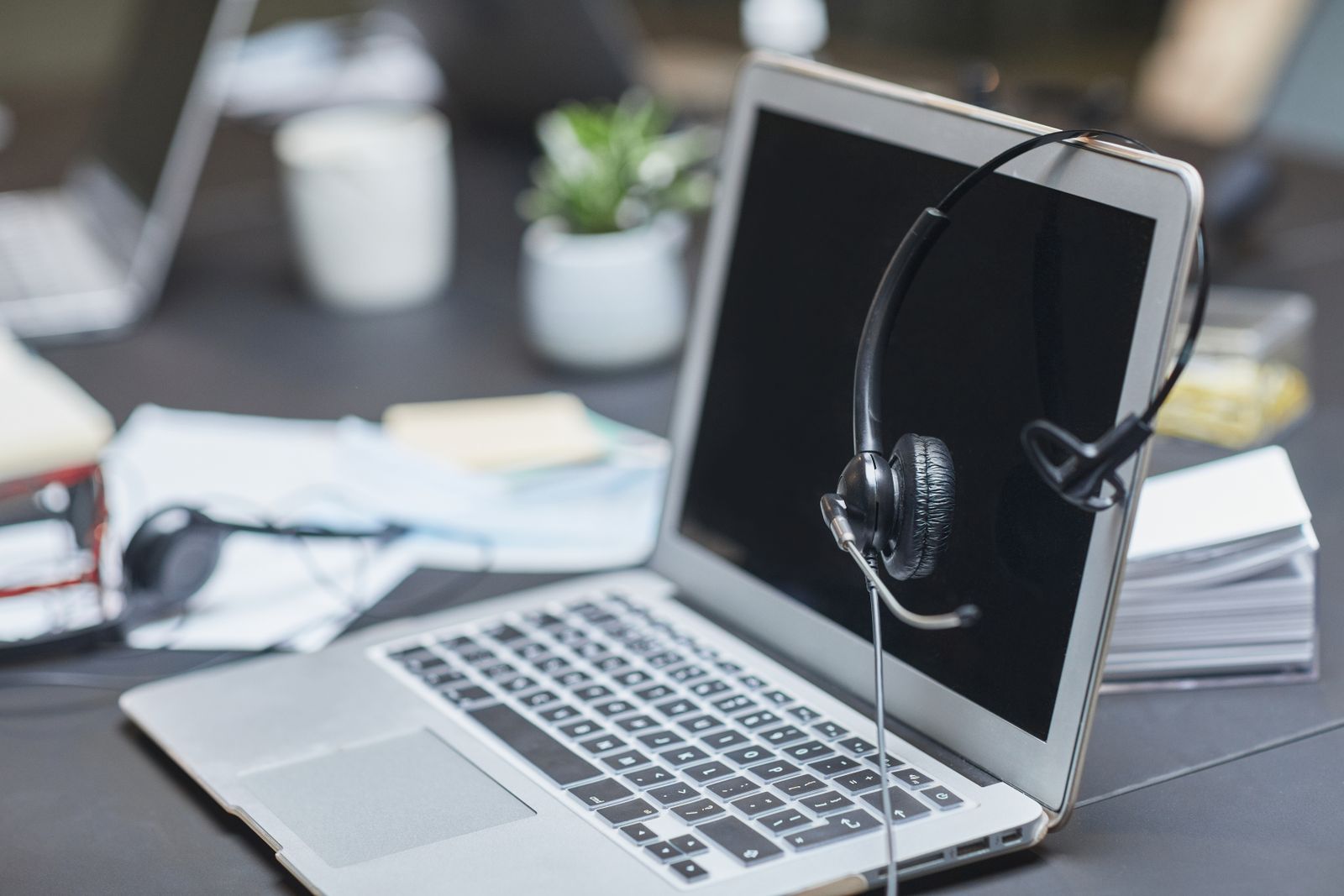 When AI Misleads Customers: Mitigating Legal, Financial, and Brand Damage From Errant Automated Responses 7 enterprise AI guardrail implementation services: call center headset and laptop for monitored automated responses.