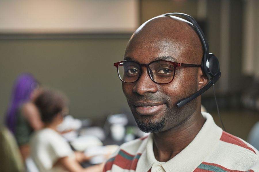 A Probate Assets Elite team member wearing a headset, ready to listen