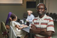 Man in White and Red Button Up Shirt Wearing Black Framed Eyeglasses