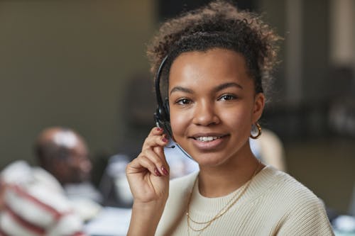 Young Woman Using a Headset 