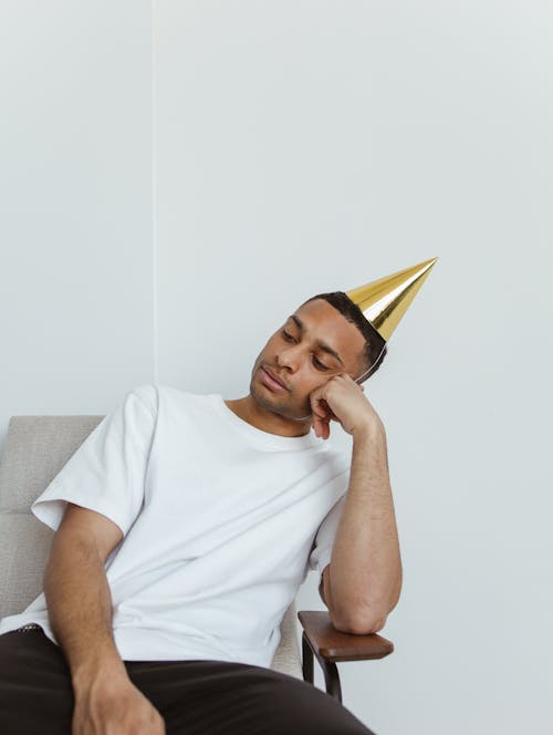 A Lonely Man Wearing Party Hat