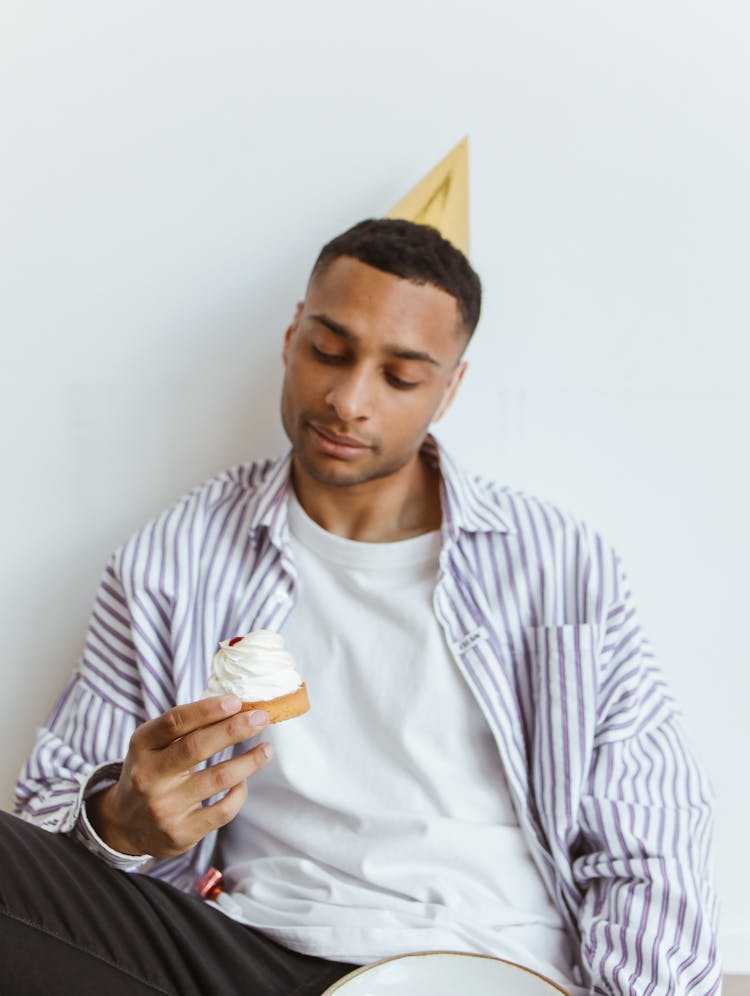 Man Holding A Cake