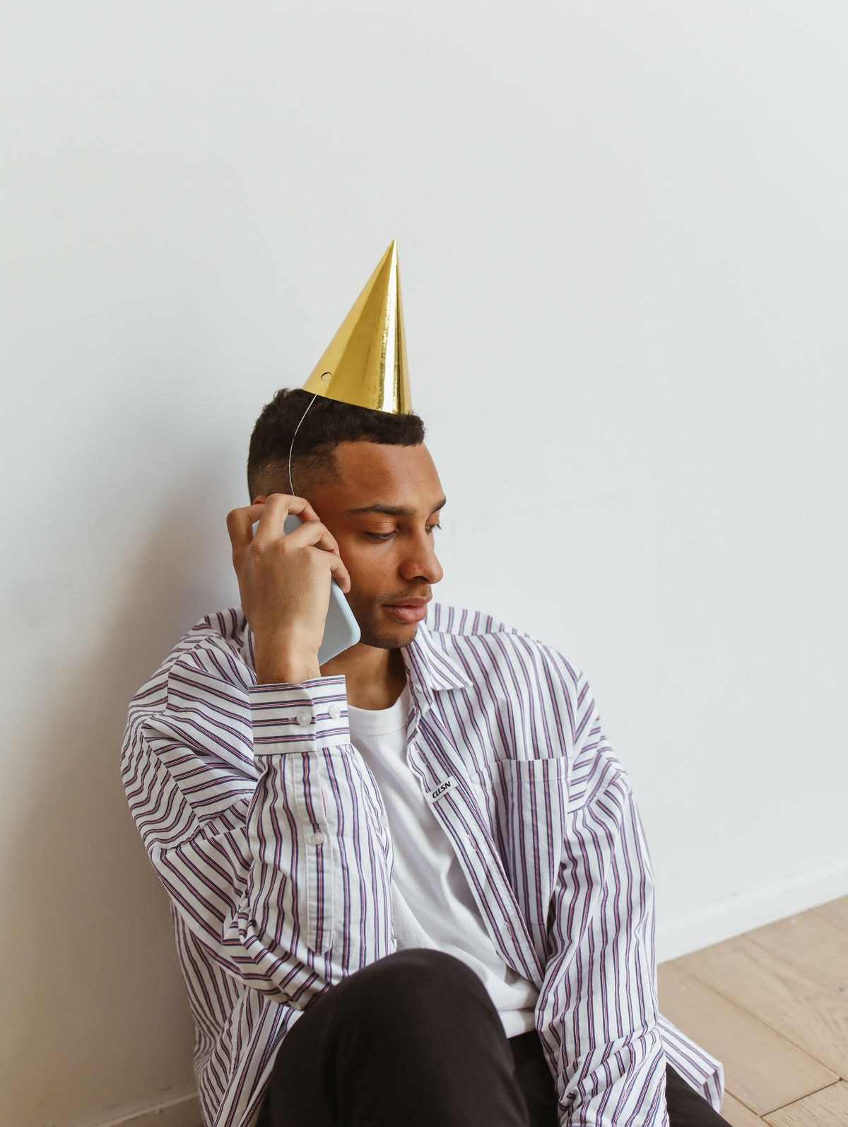 Person making a supportive phone call during a social event