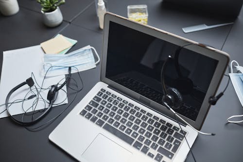 Free A Laptop and Headphones on the Table Stock Photo