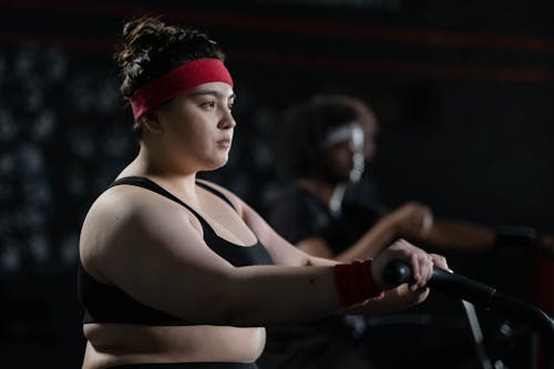 Woman in Black Activewear Exercising