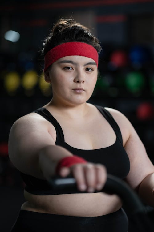 Woman in Black Activewear Exercising