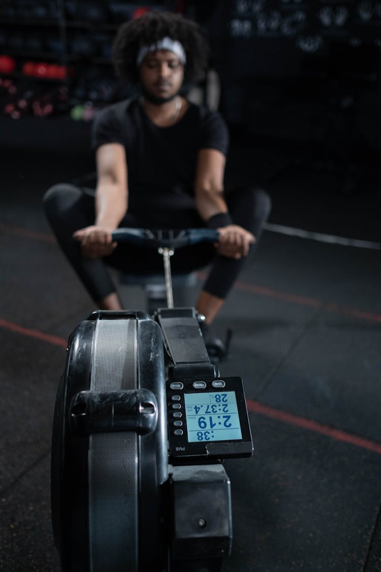 Man Using A Rowing Machine