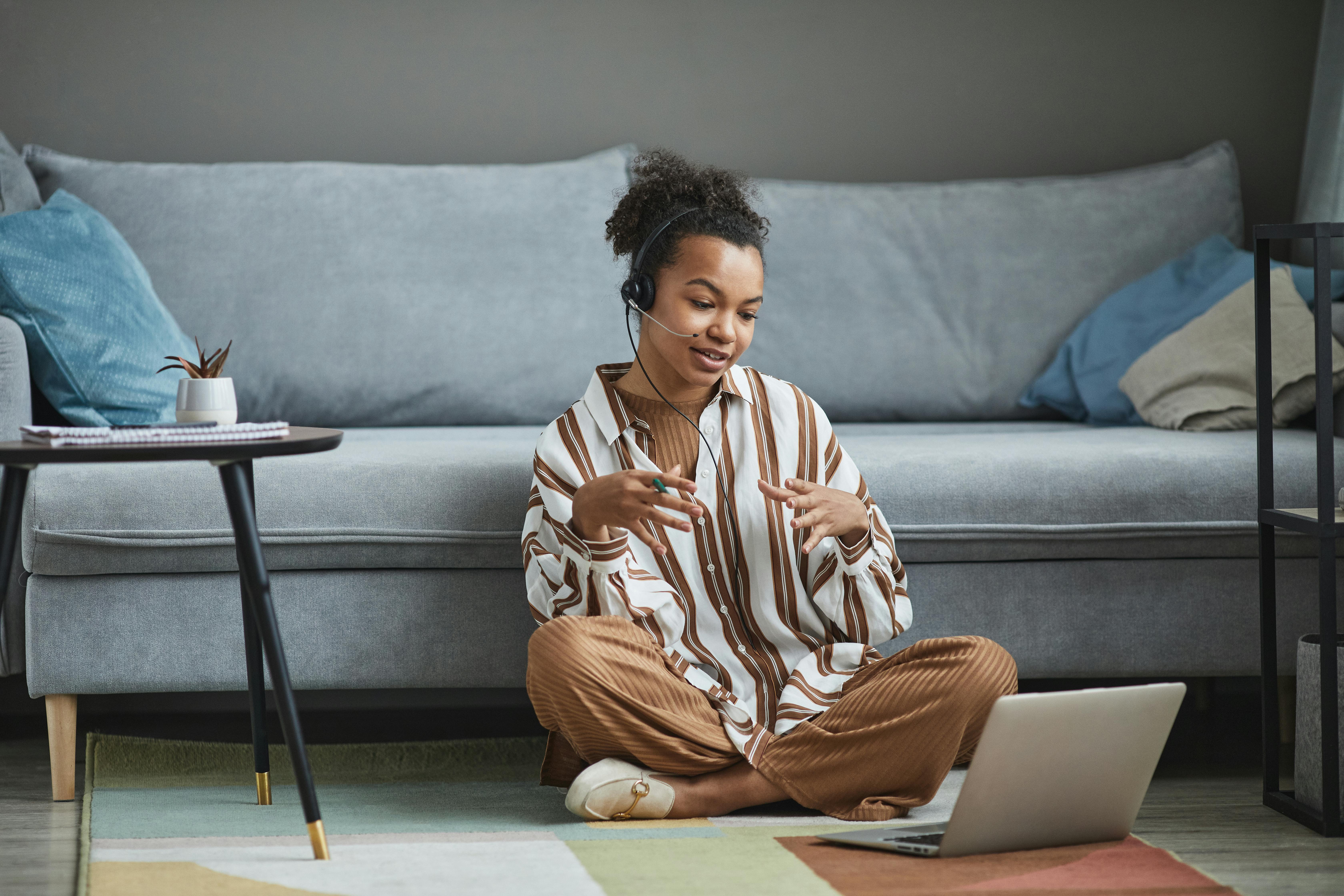 a woman having a video call on a laptop