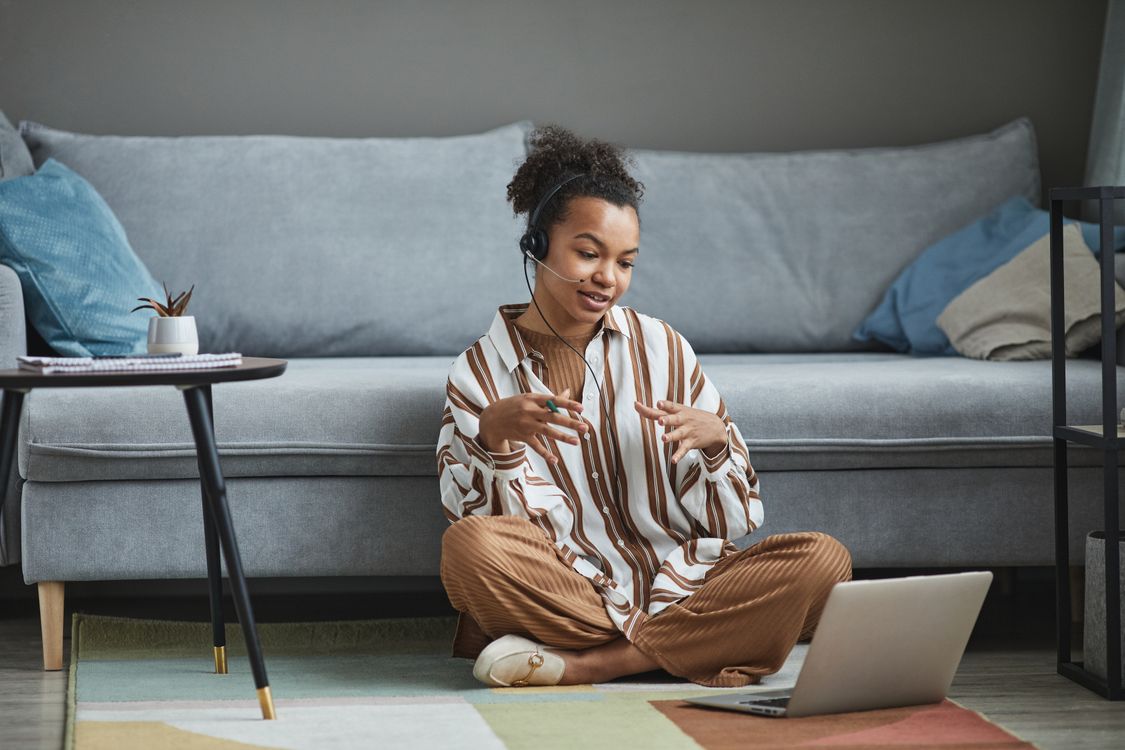 Woman preparing for an online conversation on her laptop