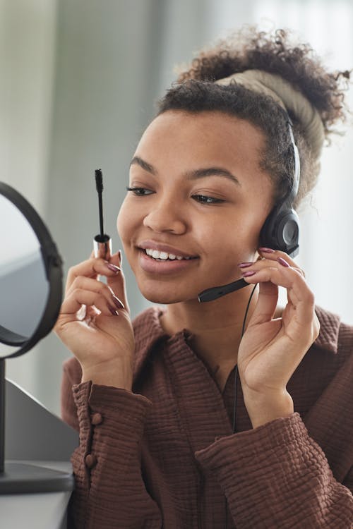 Free A Woman Using Headphones with Mic Stock Photo
