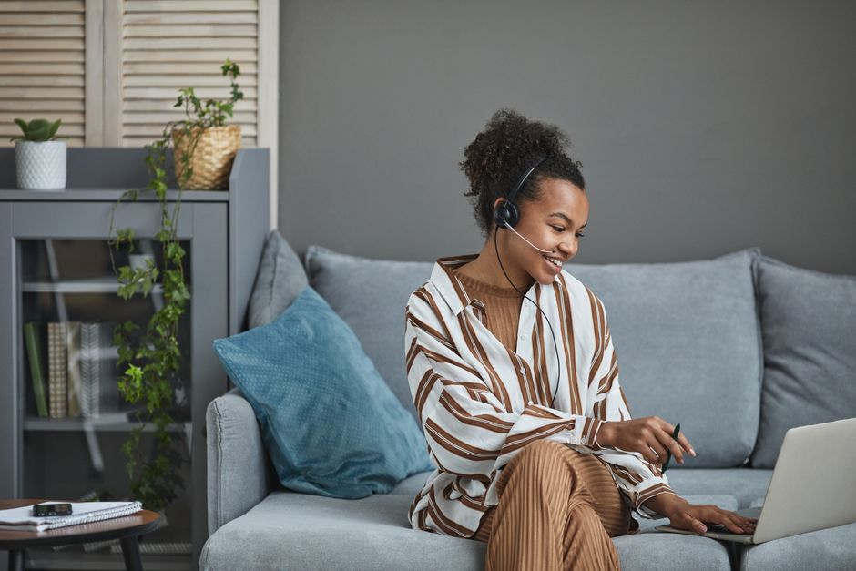 A travel agent working from home at their desk