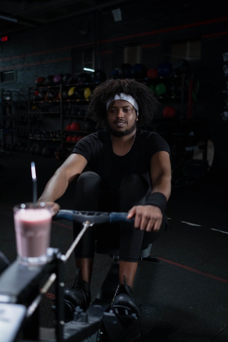 A Man In Black Activewear Exercising