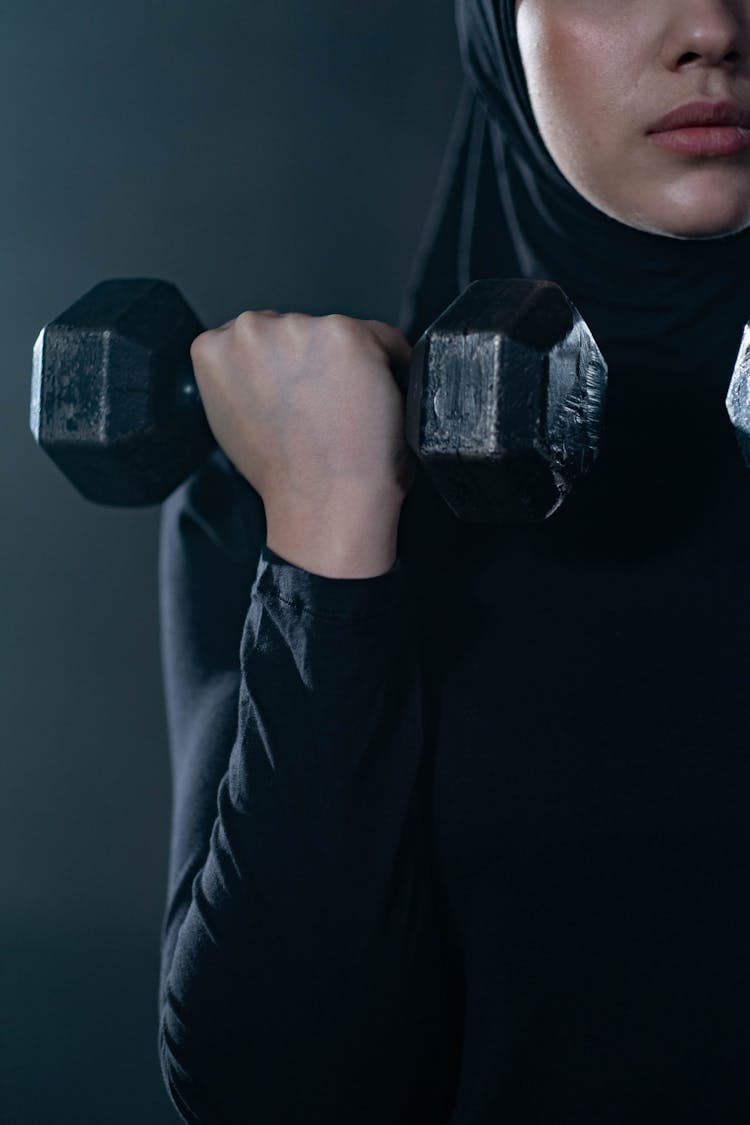 Woman Lifting A Dumbbell