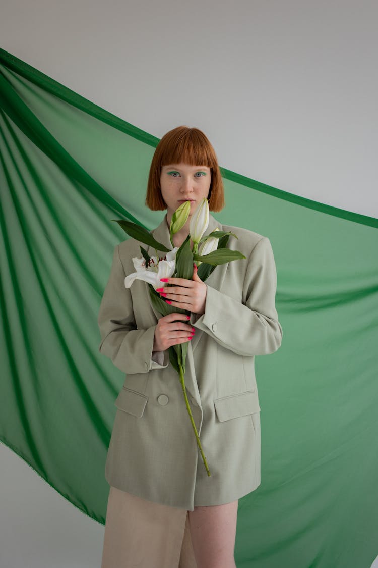 Stylish Woman With Bouquet In Studio