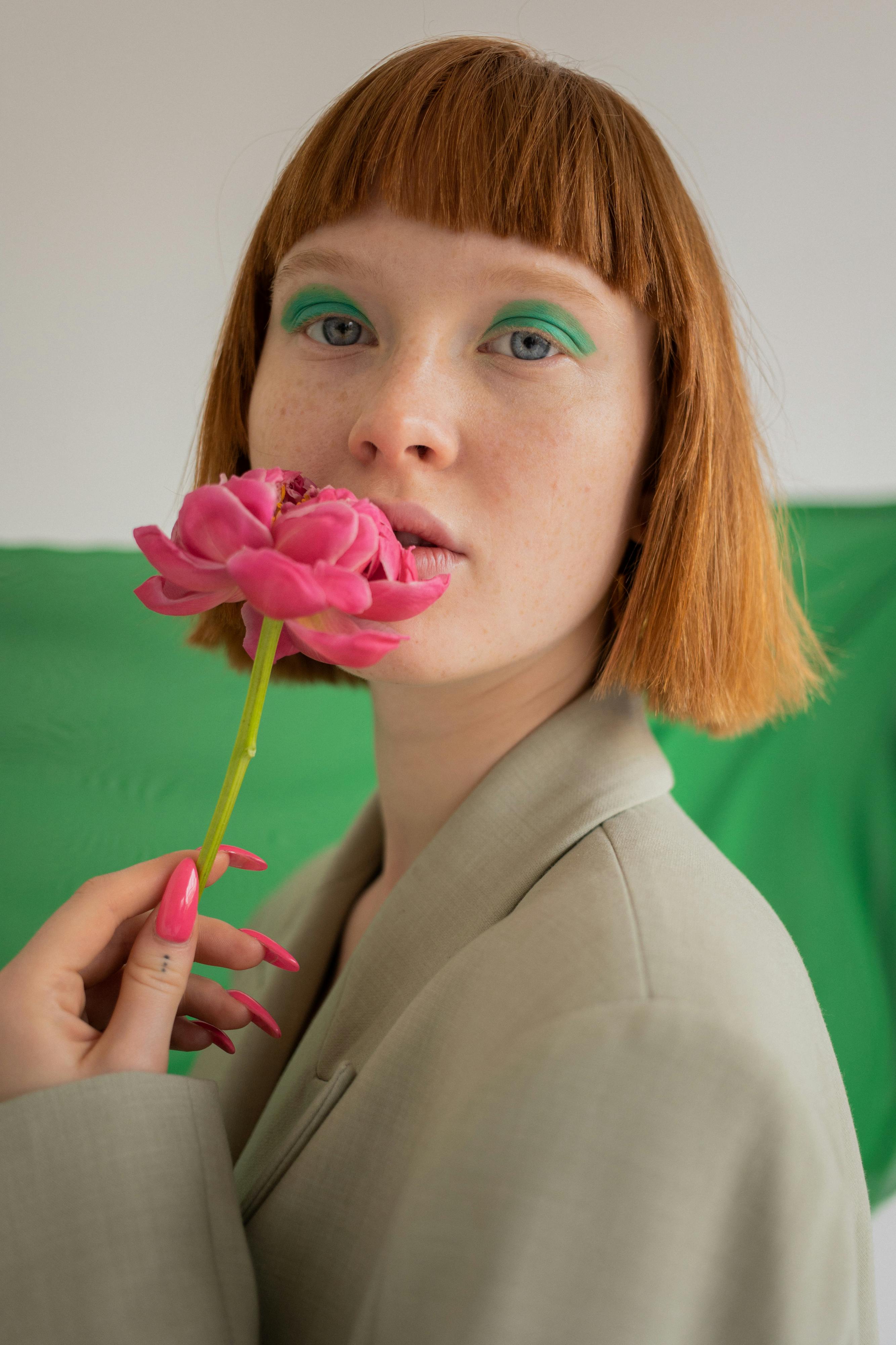 young woman with pink flower