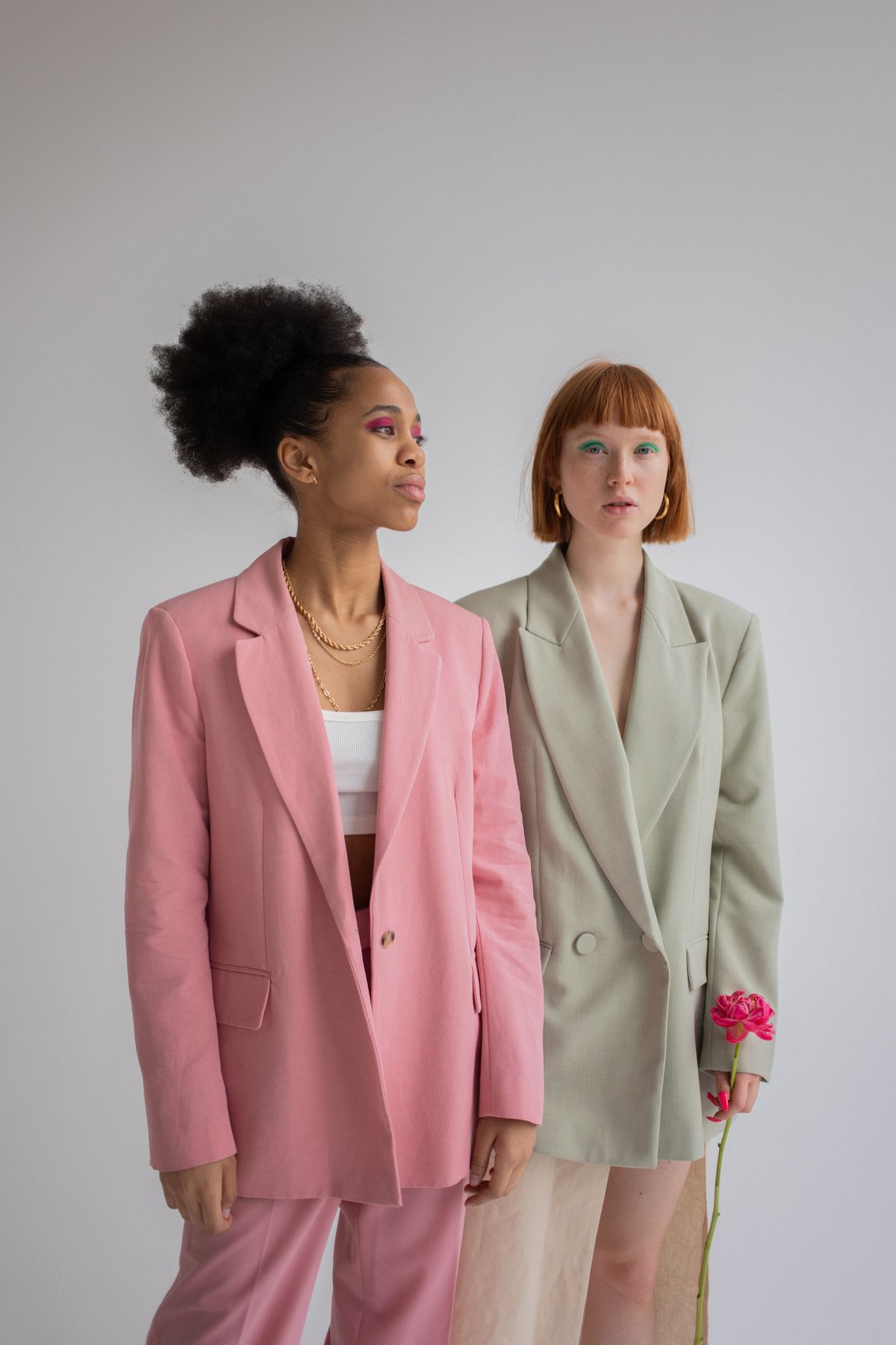 multiethnic women in stylish blazer suits showing plus size office looks