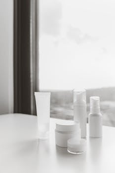 Elegant display of skincare products in a minimalist and natural setting.