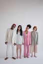 Multiracial models in trendy clothes in studio
