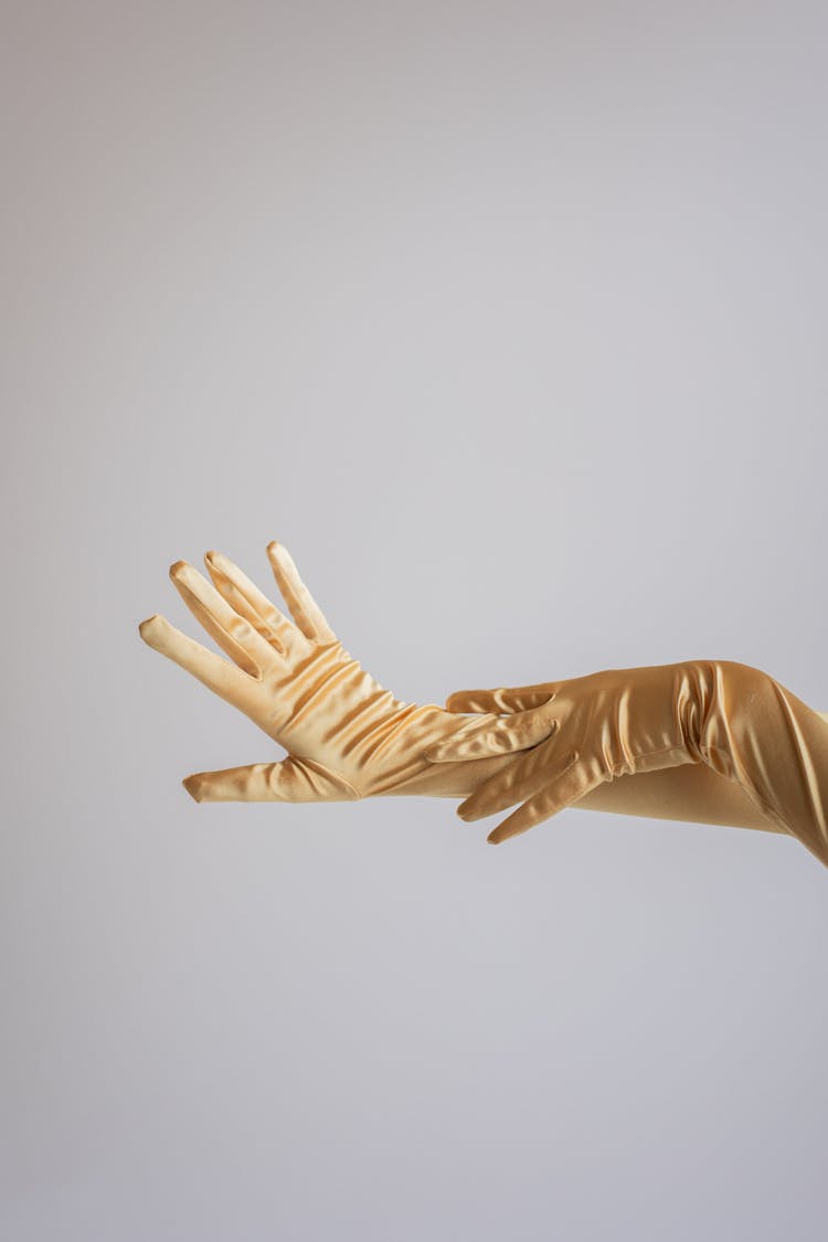 Woman In Satin Evening Gloves In Studio